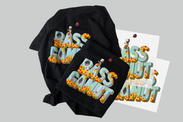 Two black and one white t-shirt by InkMerge, all with bold BASS CAWUT prints filled with cartoons, fiery motifs, and playful figures—a lively nod to patriotic parties. Available as sample Print on Demand products.